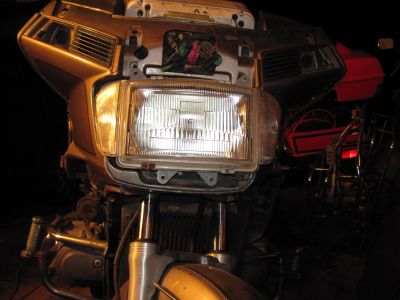 Headlight brackets removed.  The headlight is free to move now, but the wiring is holding it back.
Keywords: 1984;goldwing;gl1200